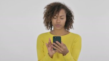 African Woman Browsing Smartphone on White Background 