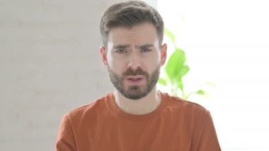 Creative Young Man Screaming and Shouting in Frustration
