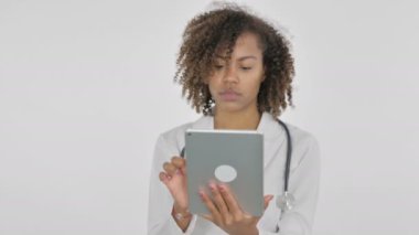 African Lady Doctor using Digital Tablet on White Background 
