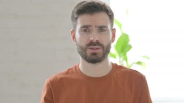 Creative Young Man having Headache, Pain in Head