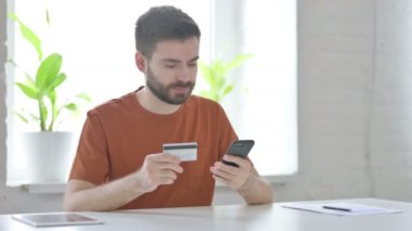 Creative Young Man Shopping Online on Smartphone, Banking