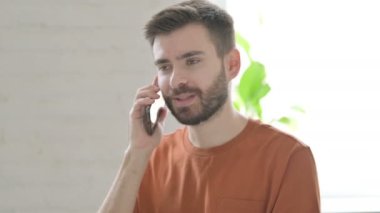 Creative Young Man Talking on Phone, Discussion