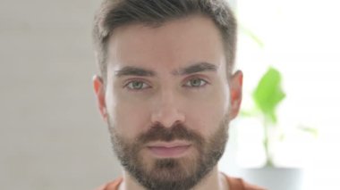 Face of Creative Young Man Smiling at the Camera 