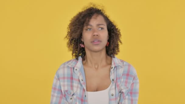 African Woman Feeling Scared Frightened Yellow Background — Stockvideo