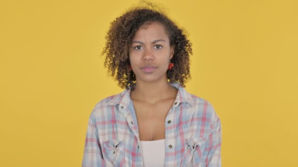 Serious African Woman Looking Camera Yellow Background — Vídeo de Stock