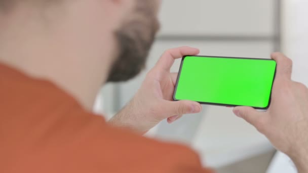 Creative Young Man Watching Smartphone Chroma Screen — Stockvideo