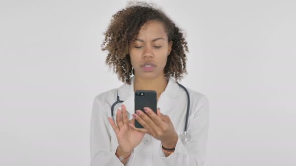 African Lady Doctor Browsing Smartphone White Background — Vídeo de Stock