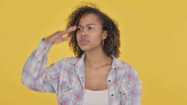 African Woman Looking Searching Yellow Screen — Stockvideo