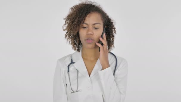 African Lady Doctor Talking Phone White Background — Stockvideo