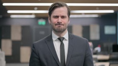 Portrait of Disappointed Young Businessman feeling Upset, Crying