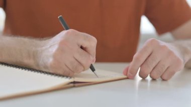 Close Up of Creative Young Man Writing Letter