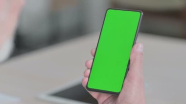 Close Up of Senior Old Man Using Smartphone with Green Screen 