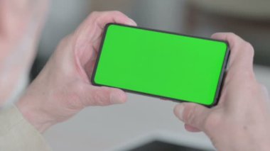 Close Up of Senior Old Man Watching Smartphone with Chroma Screen 