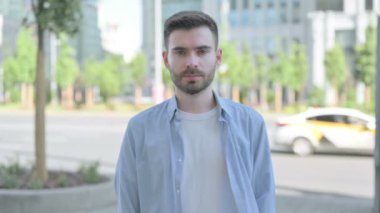 Outdoor Portrait of Man Looking at the Camera