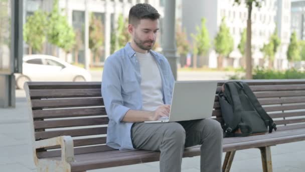 Man Laptop Looking Camera While Sitting Bench — Stockvideo