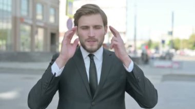 Portrait of Middle Aged Businessman having Headache Outdoor