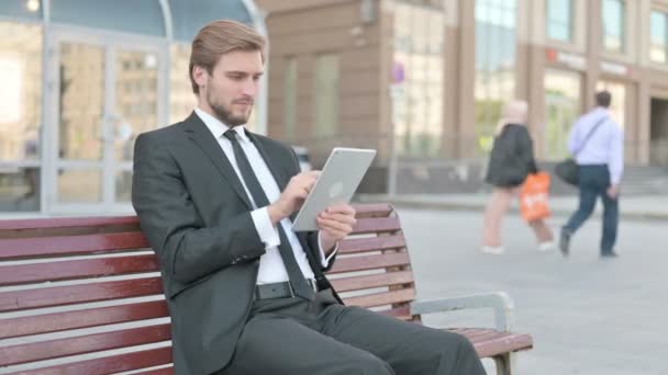 Middle Aged Businessman Using Tablet While Sitting Outdoor Bench — Stockvideo