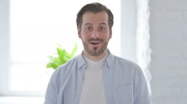 Portrait of Excited Mature Man Celebrating Success