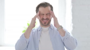 Portrait of Mature Man having Headache