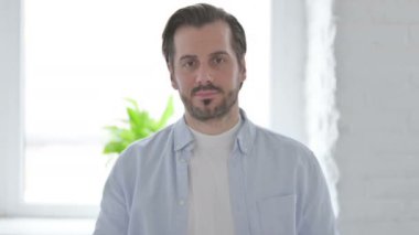 Portrait of Serious Mature Man Looking at the Camera 