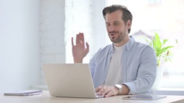 Online Video Call by Mature Man in Office