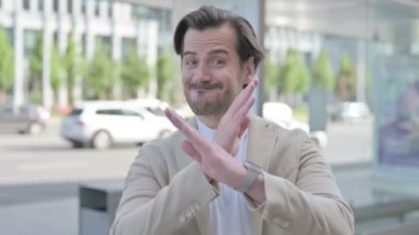 Outdoor Portrait of Rejecting Man Doing No Gesture 