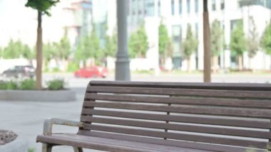 Man Coming, Sitting on Bench and Working on Laptop