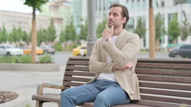 Pensive Man Thinking While Sitting Bench — Wideo stockowe