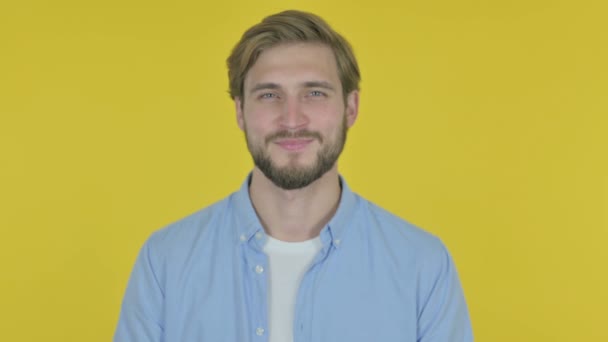 Smiling Casual Young Man Yellow Background — Stockvideo