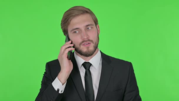 Young Adult Businessman Talking Phone Green Background — Vídeos de Stock