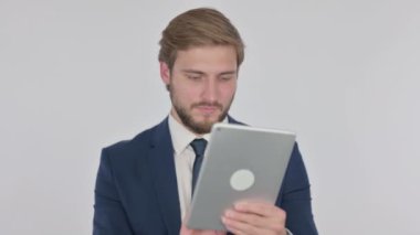 Young Adult Businessman using Digital Tablet on White Background 