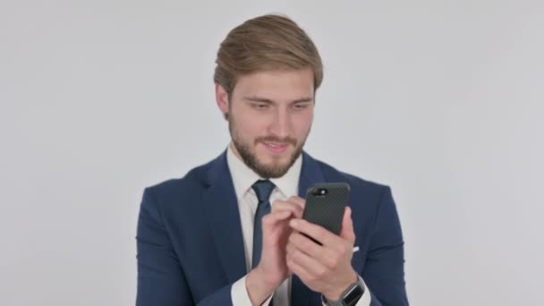 Young Adult Businessman Celebrating Smartphone White Background — Vídeos de Stock