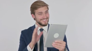 Video Call on Tablet by Young Adult Businessman on White Background 
