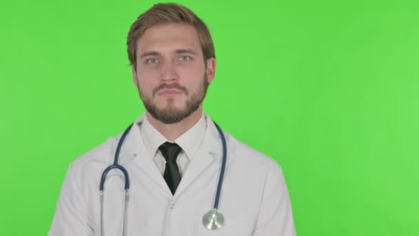 Young Adult Doctor Pointing Side Green Background — Wideo stockowe