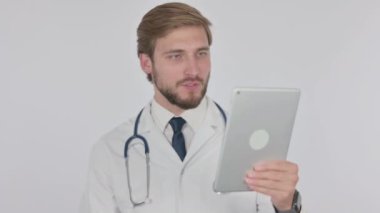 Video Call on Tablet by Young Adult Doctor on White Background 