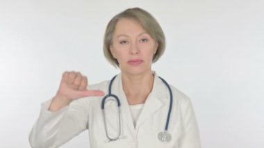 Thumbs Down by Senior Female Doctor on White Background 