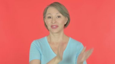 Senior Old Woman Clapping, Applauding on Red Background 