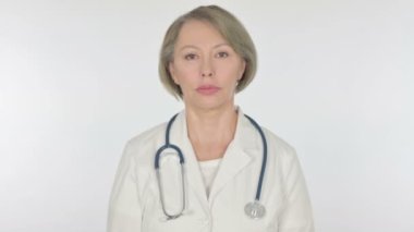 Serious Senior Female Doctor on White Background 