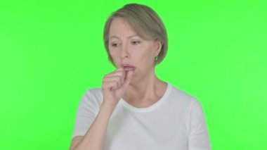 Senior Old Woman Coughing on Green Background 
