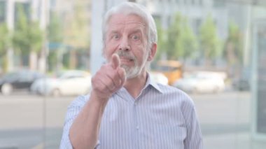 Senior Old Man Pointing at the Camera and Inviting Outdoor