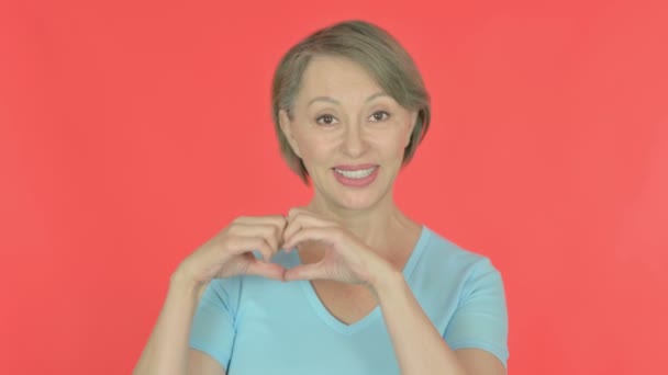 Senior Old Woman Showing Heart Shape Hands Red Background — Vídeo de stock