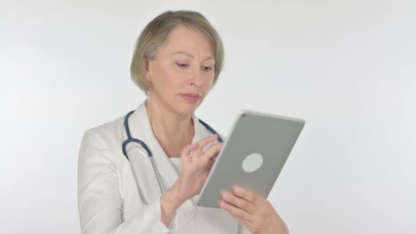 Senior Female Doctor Using Digital Tablet White Background — Stok Video