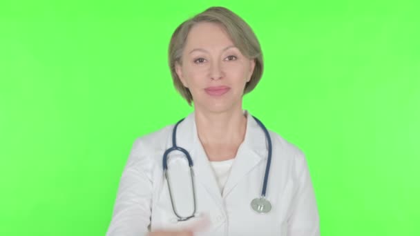 Thumbs Senior Female Doctor Green Background — Stok Video