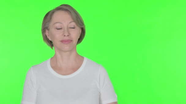 Senior Old Woman Showing Side Green Background — Video
