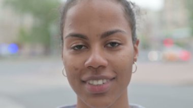 Close up of Smiling Young African Woman Face Outdoor