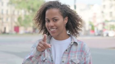 Young African Woman Pointing at the Camera Outdoor