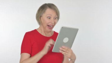 Senior Old Woman Celebrating Success on Tablet on White Background 