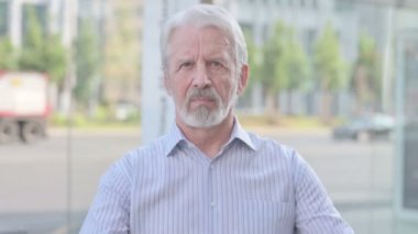 Portrait of Rejecting Senior Old Man Doing No Gesture Outdoor