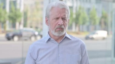 Senior Old Man Coughing while Standing Outdoor