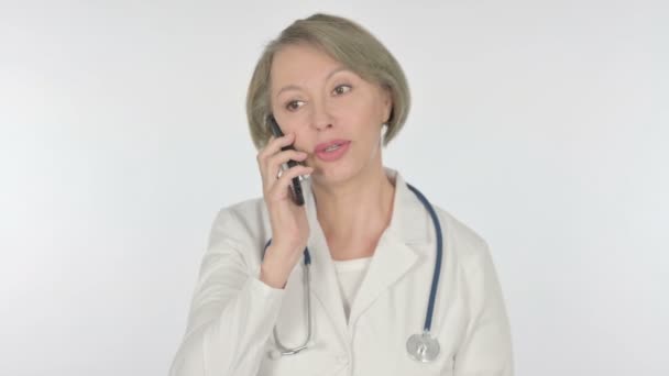 Senior Female Doctor Talking Phone White Background — Stok Video